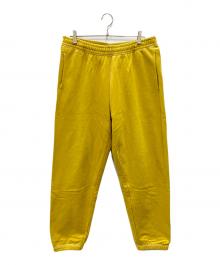 stussy（ステューシー）の古着「Contrast Stitch Label Sweat Pant」｜マスタード