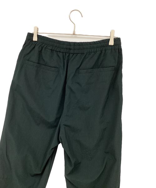 UNIVERSAL PRODUCTS.（ユニバーサルプロダクツ）UNIVERSAL PRODUCTS. (ユニバーサルプロダクツ) ナイロンシェルトラックパンツ グリーン サイズ:2の古着・服飾アイテム