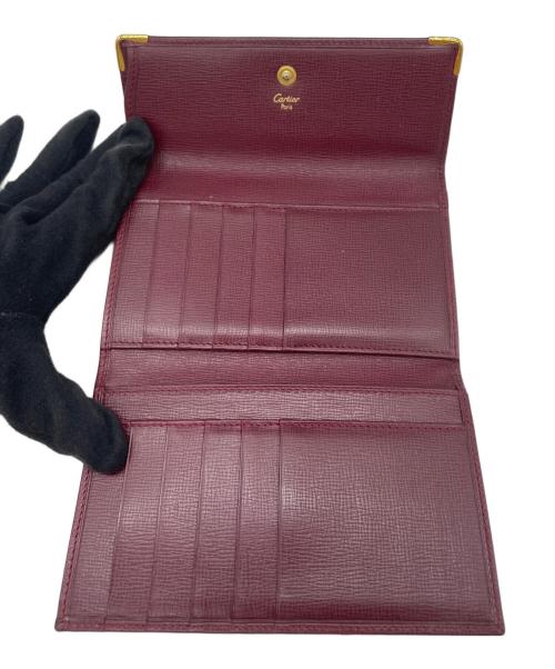 Cartier（カルティエ）Cartier (カルティエ) 3つ折り財布 ボルドー×ゴールド色の古着・服飾アイテム