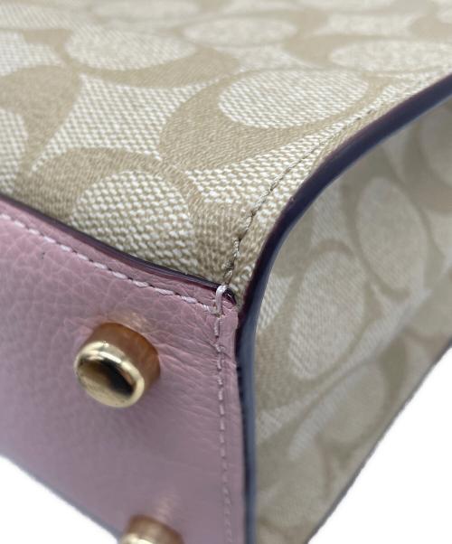 COACH（コーチ）COACH (コーチ) Disney (ディズニー) シグネチャー 2WAYバッグ  ピンクの古着・服飾アイテム