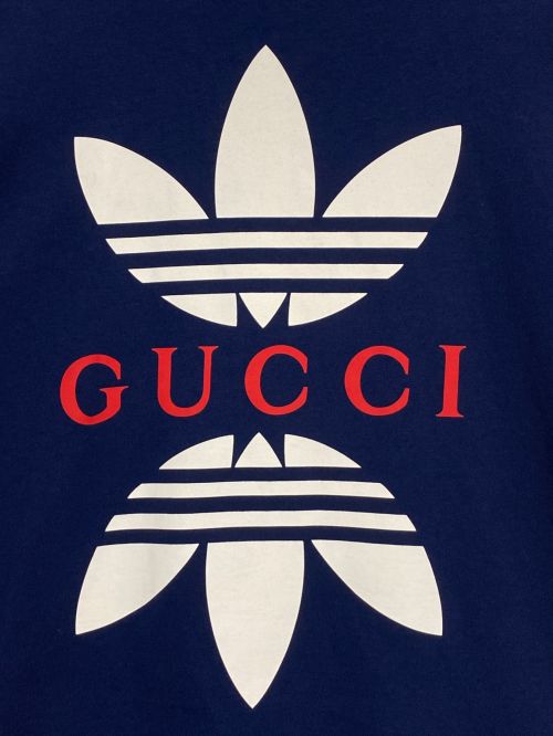 GUCCI（グッチ）GUCCI (グッチ) adidas (アディダス) プリントロゴTシャツ ネイビー サイズ:Mの古着・服飾アイテム