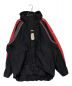BALENCIAGA（バレンシアガ）の古着「Cシェイプマウンテンパーカー」｜ブラック×レッド