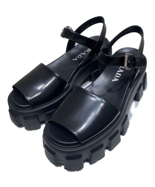 PRADA（プラダ）PRADA (プラダ) モノリスブラッシュドレザーサンダル ブラック サイズ:36 1/2の古着・服飾アイテム