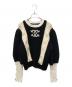 CHANEL（シャネル）の古着「Wool jumper/ココマークレースレイヤード袖ボタンニット」｜ホワイト×ブラック