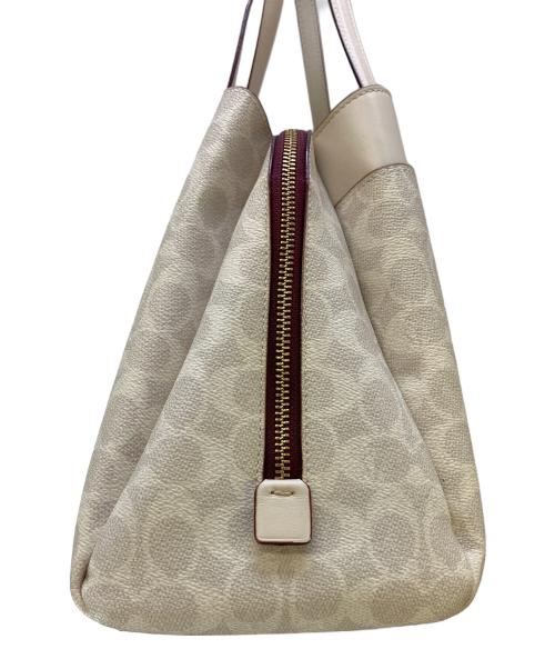 COACH（コーチ）COACH (コーチ) ハンドバッグ シグネチャー 	ローラキャリーオール アイボリーの古着・服飾アイテム