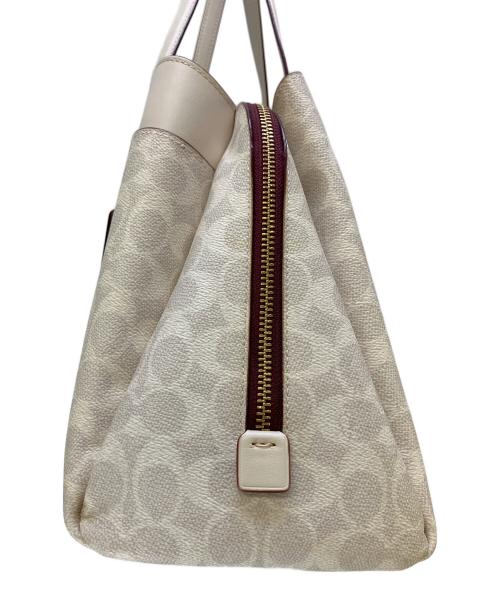 COACH（コーチ）COACH (コーチ) ハンドバッグ シグネチャー 	ローラキャリーオール アイボリーの古着・服飾アイテム