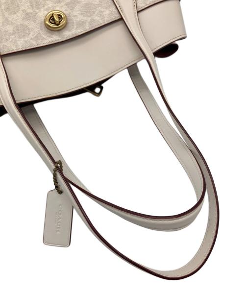 COACH（コーチ）COACH (コーチ) ハンドバッグ シグネチャー 	ローラキャリーオール アイボリーの古着・服飾アイテム