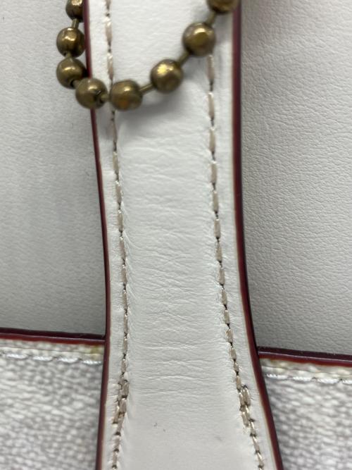 COACH（コーチ）COACH (コーチ) ハンドバッグ シグネチャー 	ローラキャリーオール アイボリーの古着・服飾アイテム