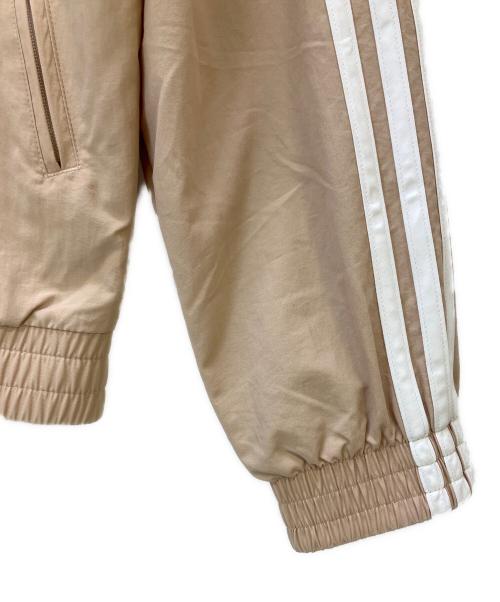 adidas（アディダス）adidas (アディダス) ウーブン ファイヤーバード トラックトップ ベージュ サイズ:XSの古着・服飾アイテム