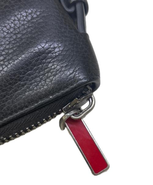 Christian Louboutin（クリスチャン・ルブタン）Christian Louboutin (クリスチャン・ルブタン) 長財布　トラベルケース/オーガナイザー ブラック×レッドの古着・服飾アイテム