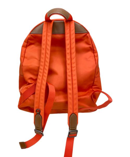 COACH（コーチ）COACH (コーチ) Keith Haring (キースヘリング) リュック オレンジの古着・服飾アイテム