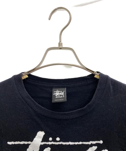 stussy（ステューシー）stussy (ステューシー) ワールドツアーロゴTee ブラック サイズ:Mの古着・服飾アイテム