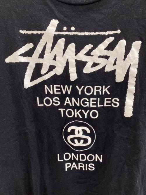 stussy（ステューシー）stussy (ステューシー) ワールドツアーロゴTee ブラック サイズ:Mの古着・服飾アイテム