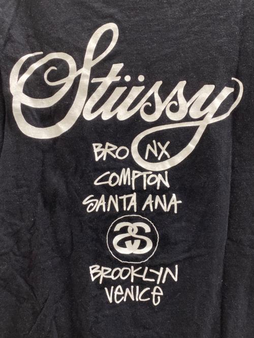 stussy（ステューシー）stussy (ステューシー) ワールドツアーロゴTee ブラック サイズ:Mの古着・服飾アイテム