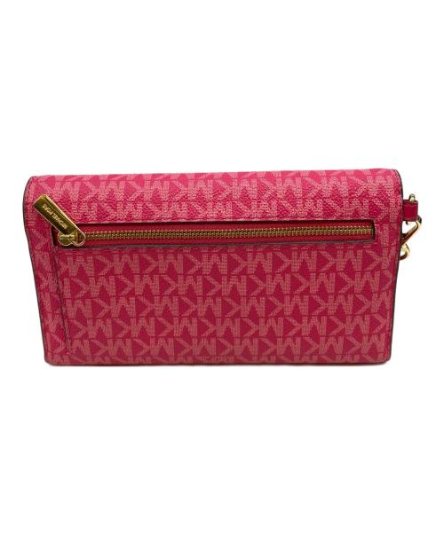 MICHAEL KORS（マイケル・コース）MICHAEL KORS (マイケル・コース) ジェットセット ラージ シグネチャー ロゴ エンベロープ リストレット ウォレット ショッキングピンクの古着・服飾アイテム