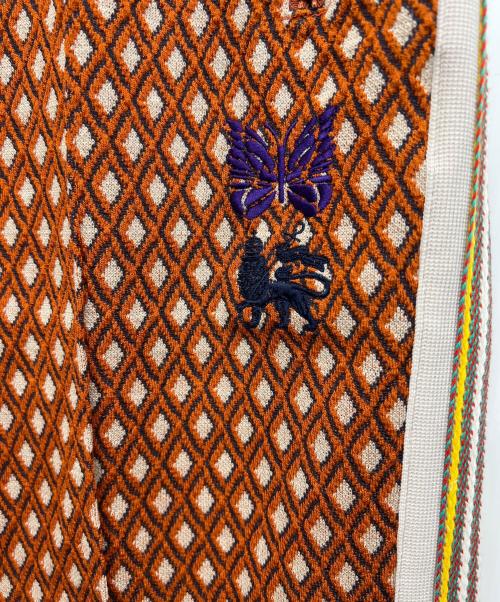 Needles（ニードルズ）Needles (ニードルズ) SASQUATCHfabrix. (サスクワッチファブリックス) トラックパンツ オレンジ サイズ:Sの古着・服飾アイテム