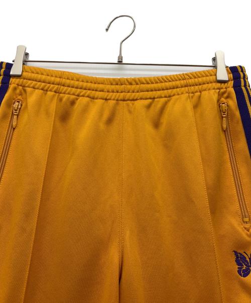 Needles（ニードルズ）Needles (ニードルズ) ナロートラックパンツ オレンジ×パープル サイズ:Mの古着・服飾アイテム