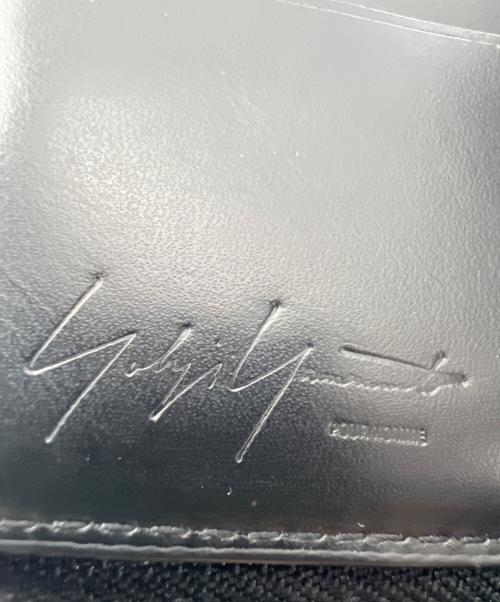 Yohji Yamamoto pour homme（ヨウジヤマモト プールオム）Yohji Yamamoto pour homme (ヨウジヤマモト プールオム) 2つ折り財布 COW LEATHER FASTENER WALLET S ブラックの古着・服飾アイテム