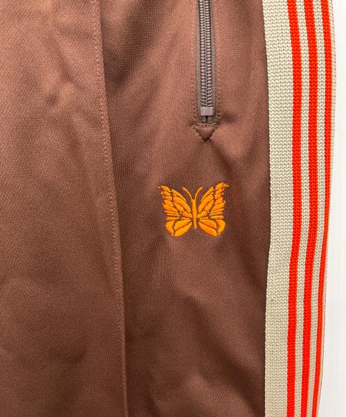 Needles（ニードルズ）Needles (ニードルズ) トラックパンツ ブラウン×オレンジ サイズ:Sの古着・服飾アイテム