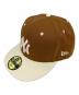 New Era（ニューエラ）の古着「キャップ」｜ブラウン×ホワイト