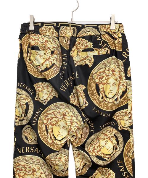VERSACE（ヴェルサーチェ）VERSACE (ヴェルサーチェ) 柄パンツ ブラック×イエロー サイズ:Mの古着・服飾アイテム