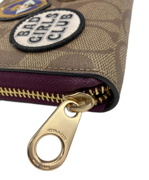 COACH（コーチ）COACH (コーチ) DISNEY (ディズニー) ロング ジップ アラウンド ウォレット ブラウン×パープルの古着・服飾アイテム