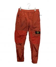 STONE ISLAND（ストーンアイランド）の古着「ナイロンパンツ」｜レッド