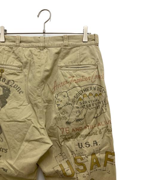 AVIREX（アヴィレックス）AVIREX (アヴィレックス) 60’s ARMY CHINO PANTS ”ARCHIVE GRAPHIC カーキ サイズ:Lの古着・服飾アイテム