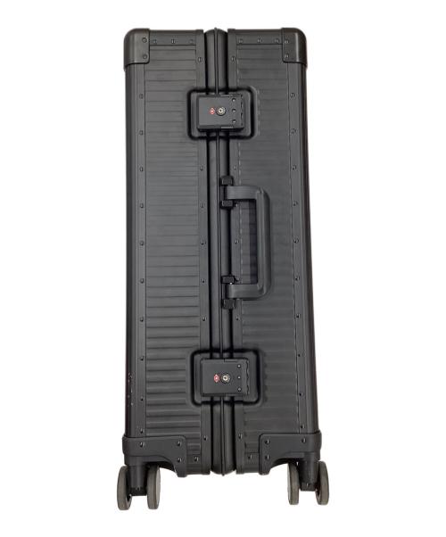 aucentic（オーセンティック）aucentic (オーセンティック) ストライプアルミニウムスーツケース ブラックの古着・服飾アイテム