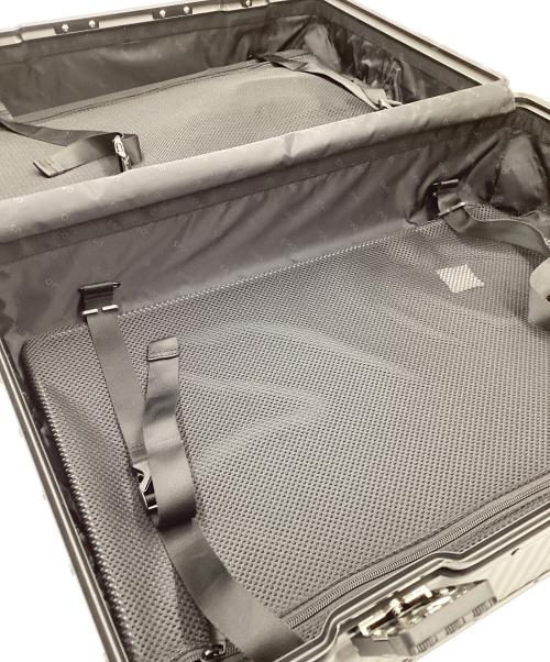 aucentic（オーセンティック）aucentic (オーセンティック) ストライプアルミニウムスーツケース ブラックの古着・服飾アイテム