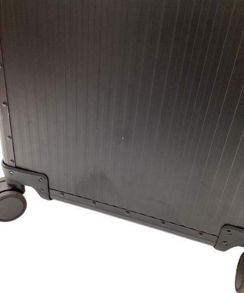 aucentic（オーセンティック）aucentic (オーセンティック) ストライプアルミニウムスーツケース ブラックの古着・服飾アイテム