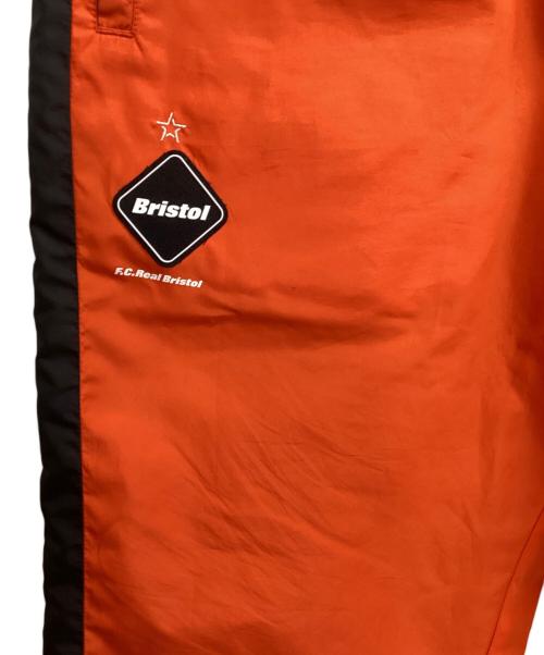 F.C.R.B.（エフシーレアルブリストル）F.C.R.B. (エフシーレアルブリストル) リバーシブルトラックパンツ グリーン×オレンジ サイズ:Lの古着・服飾アイテム