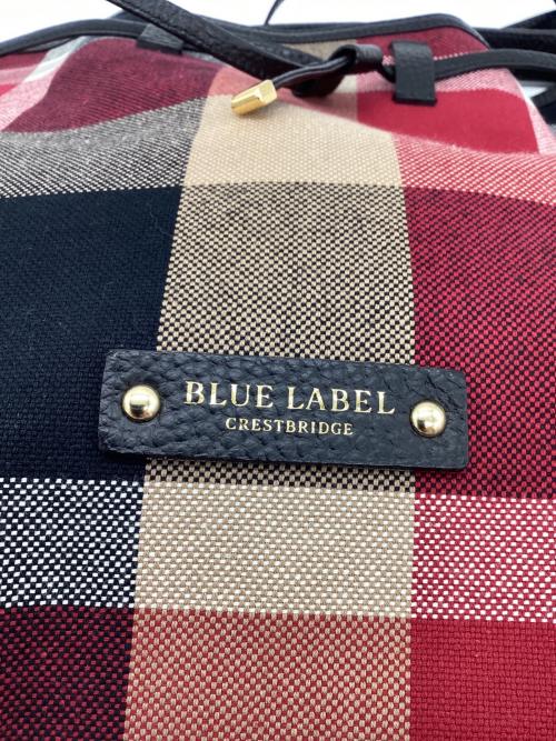 BLUE LABEL CRESTBRIDGE（ブルーレーベルクレストブリッジ）BLUE LABEL CRESTBRIDGE (ブルーレーベルクレストブリッジ) キャンバスコロンバッグ ブラック×レッドの古着・服飾アイテム