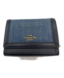 COACH（コーチ）の古着「デニムミディアムフラップウォレット」｜インディゴ