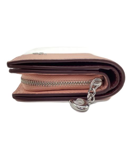 COACH（コーチ）COACH (コーチ) 2つ折り財布 ピンクの古着・服飾アイテム