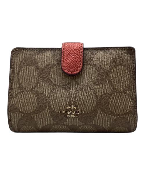 COACH（コーチ）COACH (コーチ) 2つ折り財布 シグネチャー ブラウン×ピンクの古着・服飾アイテム