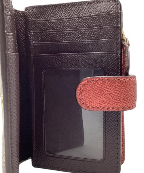 COACH（コーチ）COACH (コーチ) 2つ折り財布 シグネチャー ブラウン×ピンクの古着・服飾アイテム