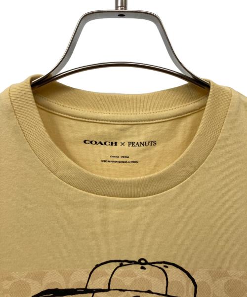 COACH（コーチ）COACH (コーチ) PEANUTS (ピーナッツ) 半袖Tシャツ イエロー サイズ:XSの古着・服飾アイテム