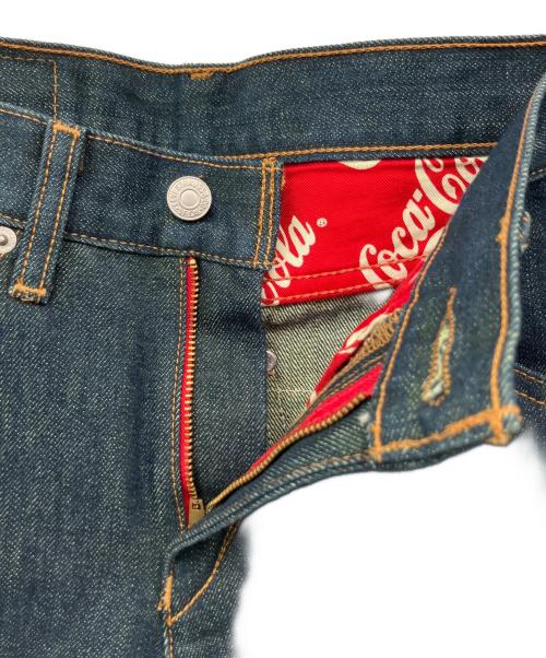 LEVI'S（リーバイス）LEVI'S (リーバイス) Coca Cola (コカコーラ) ジーンズ インディゴ サイズ:W29の古着・服飾アイテム