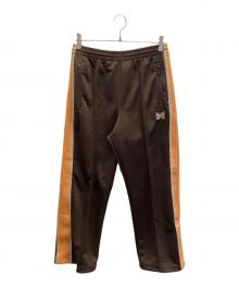 Needles（ニードルズ）の古着「トラックパンツ」｜ブラウン×オレンジ