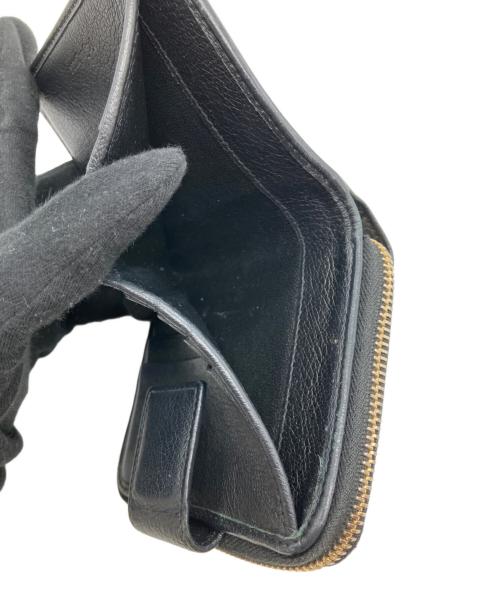 Yves Saint Laurent（イヴサンローラン）Yves Saint Laurent (イヴサンローラン) 2つ折り財布 ブラックの古着・服飾アイテム