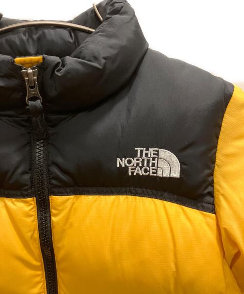 THE NORTH FACE（ザ ノース フェイス）THE NORTH FACE (ザ ノース フェイス) ヌプシジャケット ブラック×オレンジ サイズ:120の古着・服飾アイテム