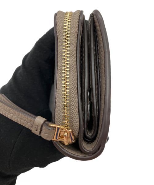 TORY BURCH（トリーバーチ）TORY BURCH (トリーバーチ) 2つ折り財布 ベージュの古着・服飾アイテム