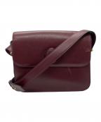 Cartierカルティエ）の古着「マストラインターンロックショルダーバッグ」｜ワインレッド