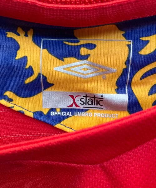 UMBRO（アンブロ）UMBRO (アンブロ) ゲームシャツ　リヨン　06/07 レッド サイズ:Ｌの古着・服飾アイテム