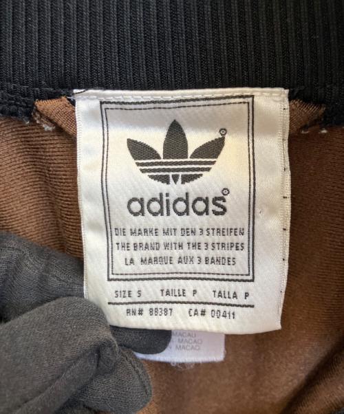 adidas（アディダス）adidas (アディダス) ハーフジップトラックジャケット ブラック×ブラウン サイズ:Ｓの古着・服飾アイテム