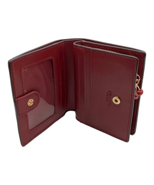 COACH（コーチ）COACH (コーチ) チェリー柄2つ折り財布 ブラウンの古着・服飾アイテム