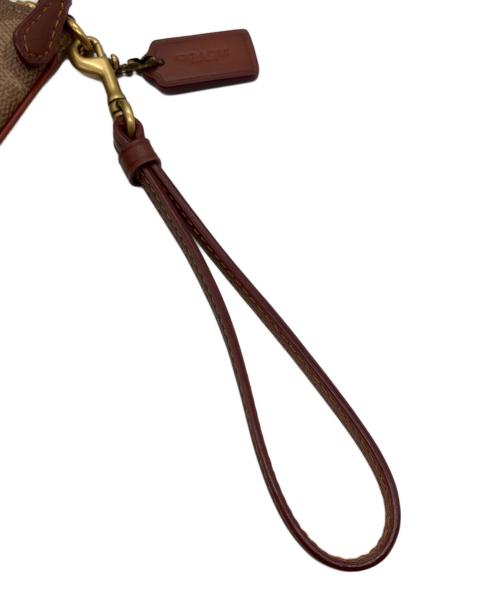 COACH（コーチ）COACH (コーチ) レキシー ホリデー　携帯ポーチ ブラウンの古着・服飾アイテム