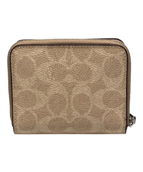 COACH（コーチ）COACH (コーチ) DISNEY (ディズニー) 2つ折り財布 ベージュの古着・服飾アイテム