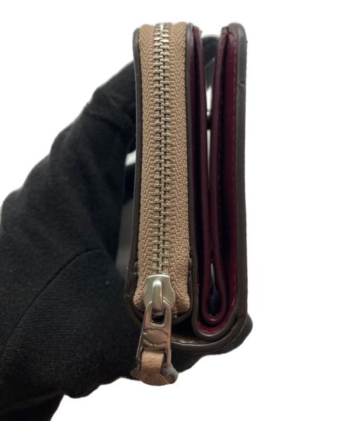 COACH（コーチ）COACH (コーチ) DISNEY (ディズニー) 2つ折り財布 ベージュの古着・服飾アイテム